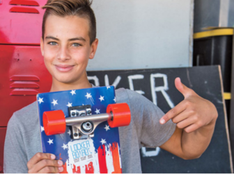 Teenager Carson Kropfl and his designed skateboard