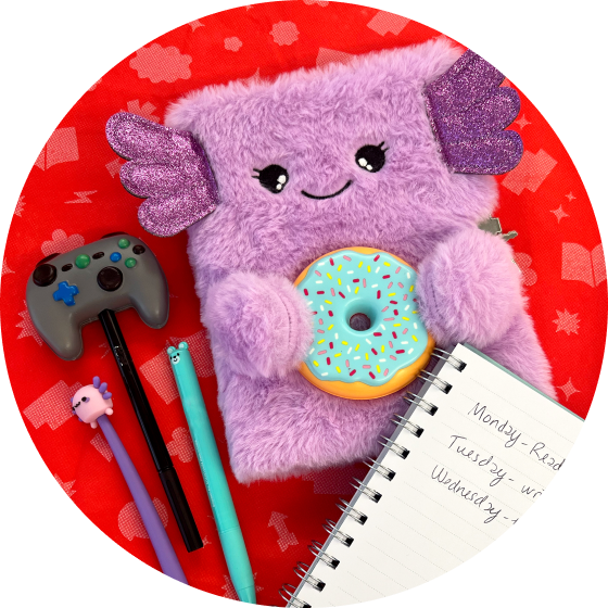 A fuzzy purple notebook lays next to pencils and other writing utensils