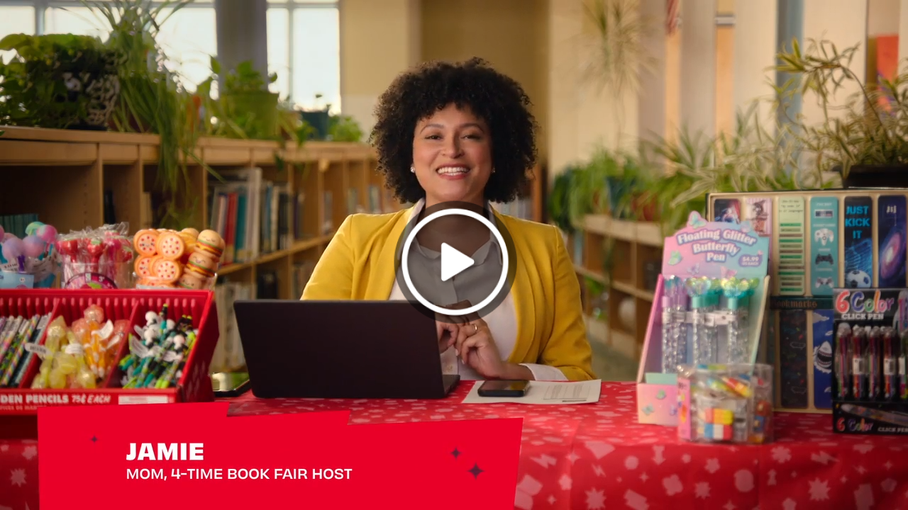 A Book Fair Host using a scanner in the Payment Portal