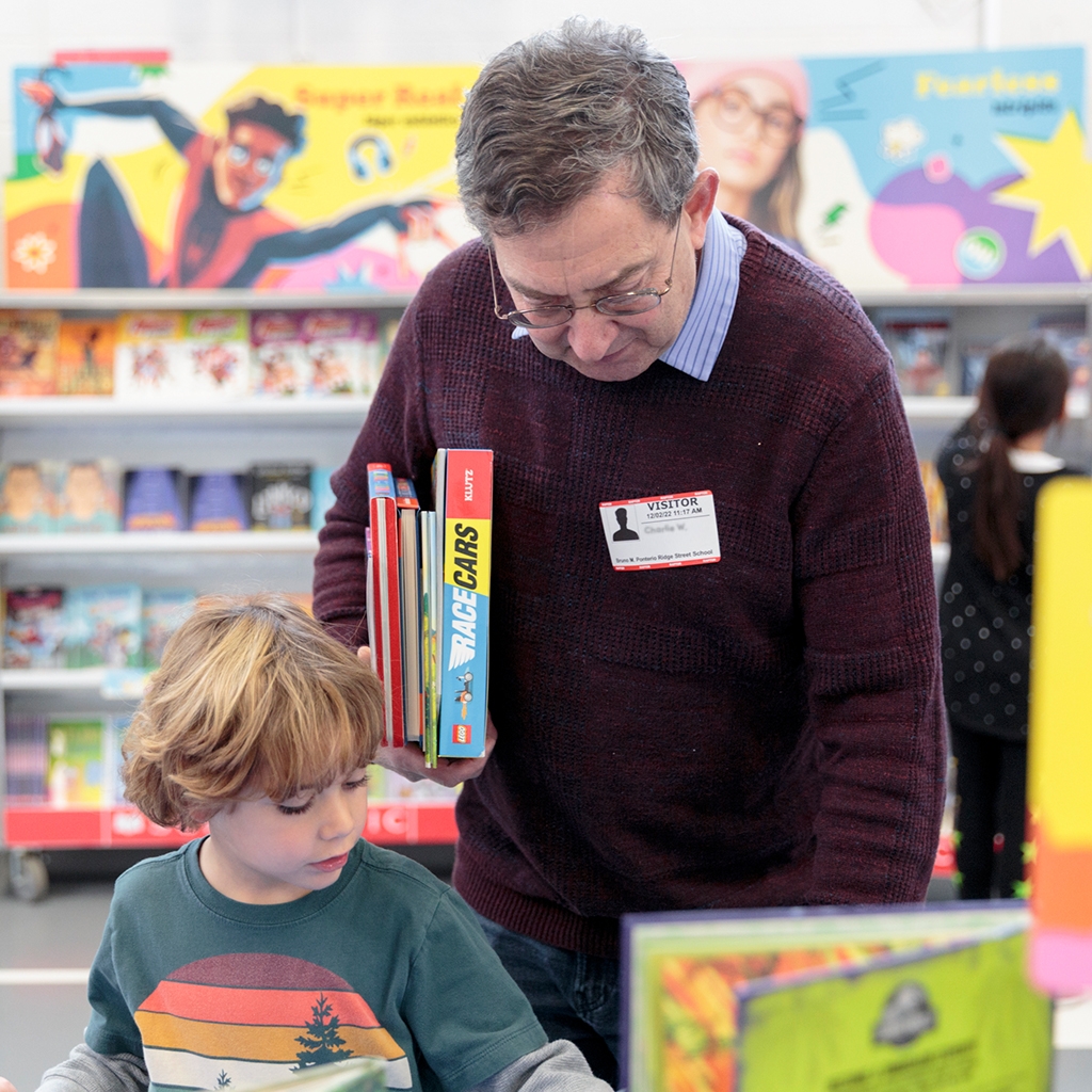 A student and a relative shop the Book Fair together at a Family event