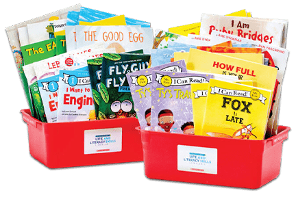 Scholastic red book bins filled with books from the Byron Garrett Life & Literacy Skills library.