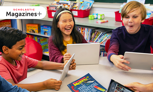 Students interacting with magazines and online resources in the classroom.